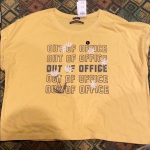 Yellow top, slightly cropped, loose fit